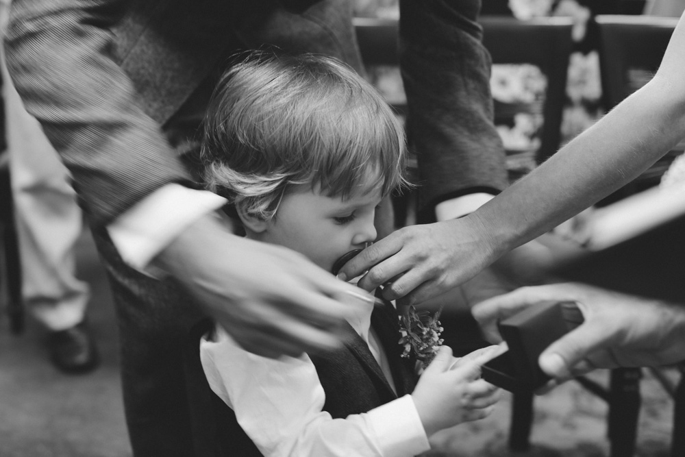 getting rings at Islington Town Hall wedding by love oh love photography