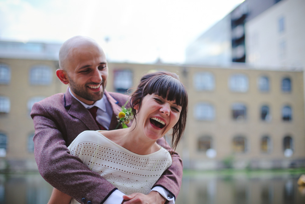 bride and groom laughing